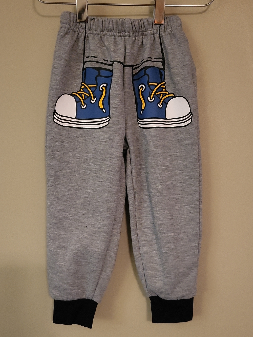 Grey joggers with blue sneaker print